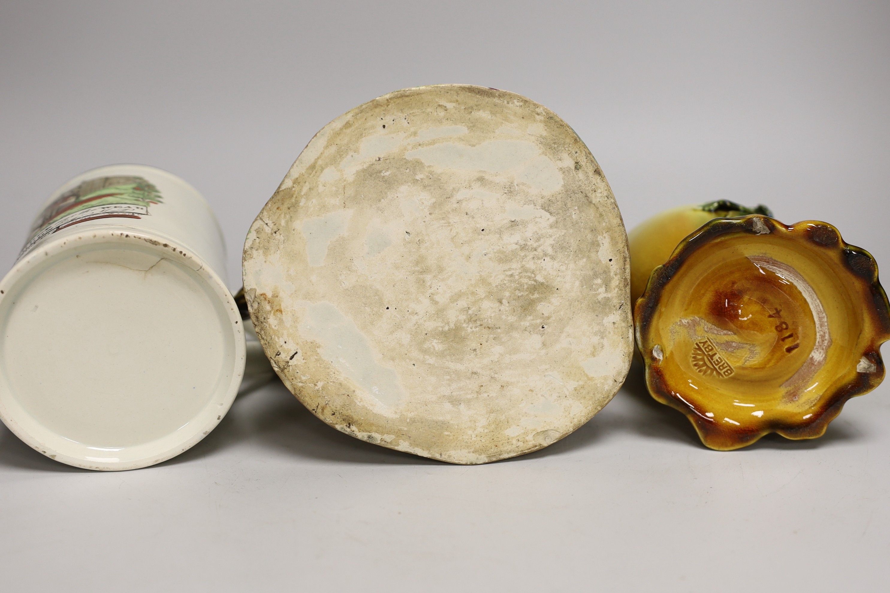 An early Staffordshire figure group, a Bretby egg shaped vase and a 19th century Iron Bridge frog tankard, figure group 24cms high